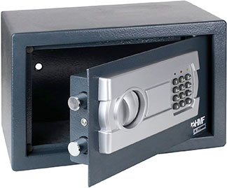 Caja fuerte de color gris con la puerte abierta mostrando interior vacio