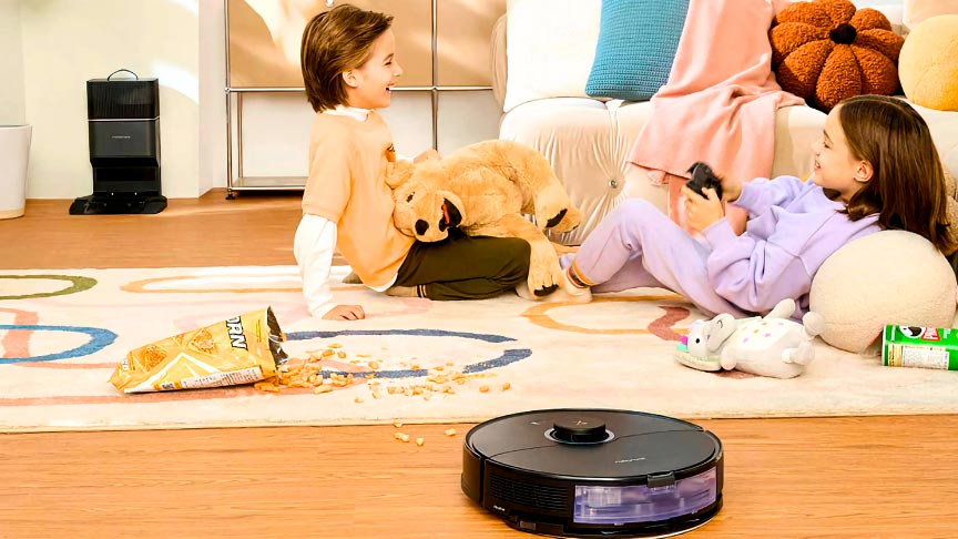 robot aspirador Roborock Serie S8 en color blanco aspirando la comida en la habitación de los niños