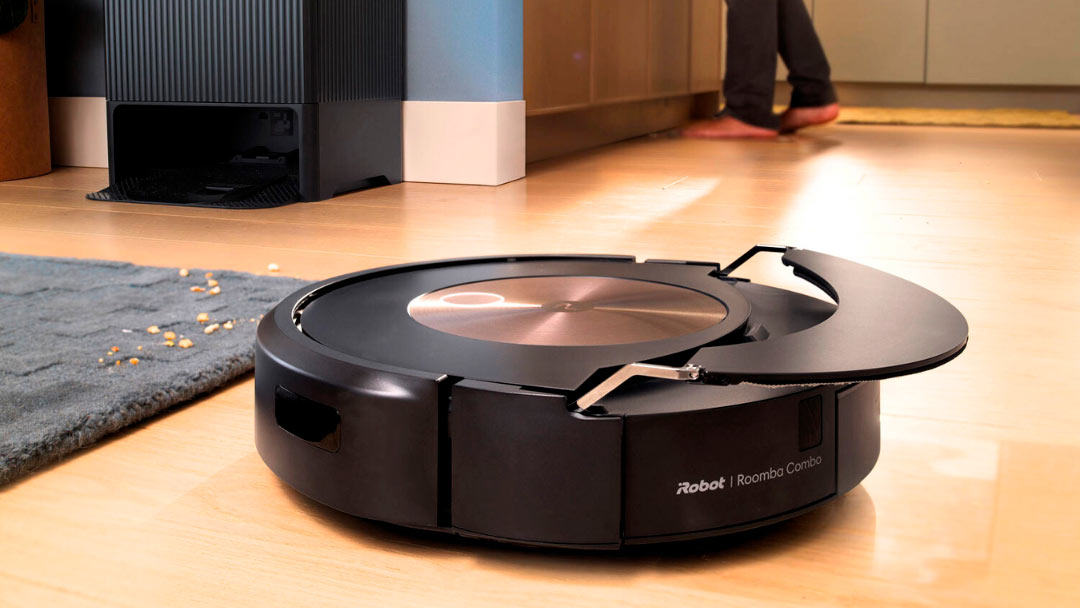 uno de los mejores robot aspirador Roomba en el suelo del salón